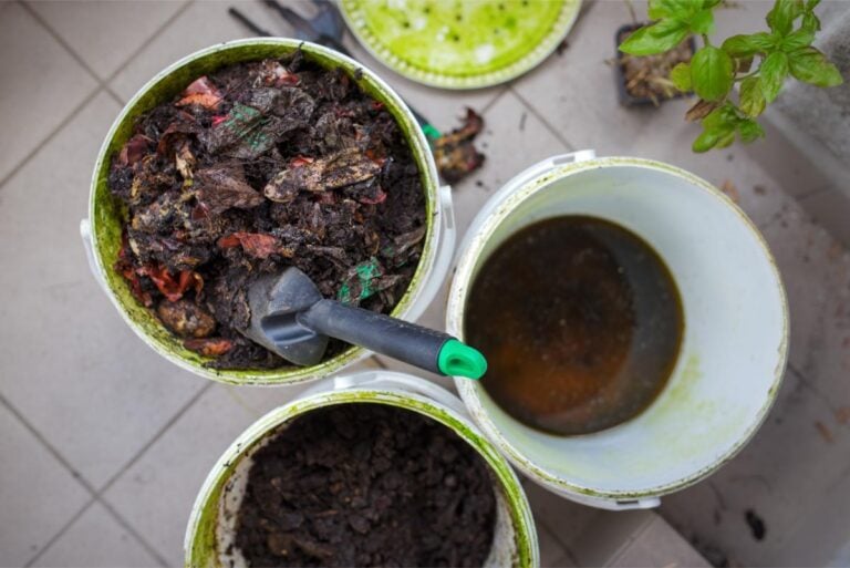 White Buckets Being Used for Composting on an Apartment Balcony